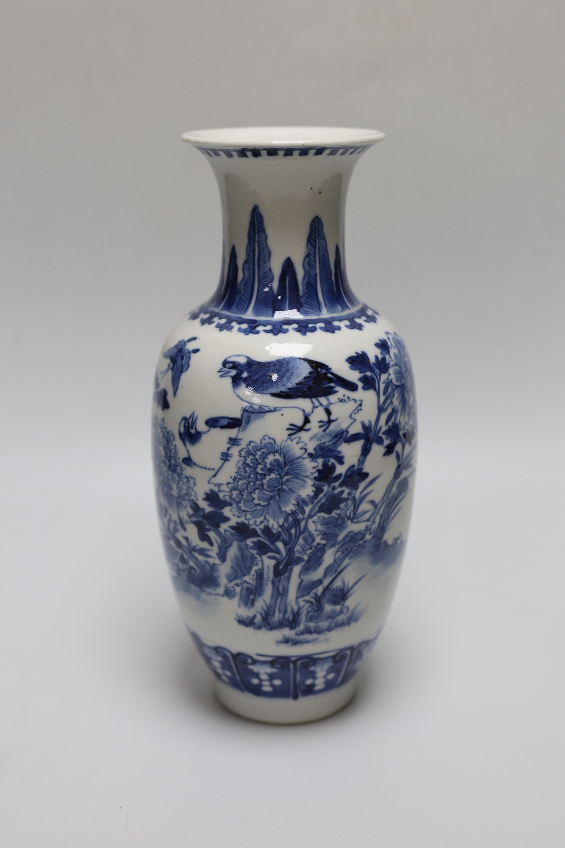 A 19th century Chinese blue and white ‘birds, rockwork and peonies’ vase, 26cm